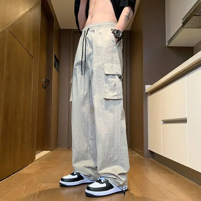 

Весенне-осенние новые однотонные брюки-карго с эластичной резинкой на талии и свободными карманами на шнурке в американском стиле, универсальные быстросохнущие брюки-карго JJ808