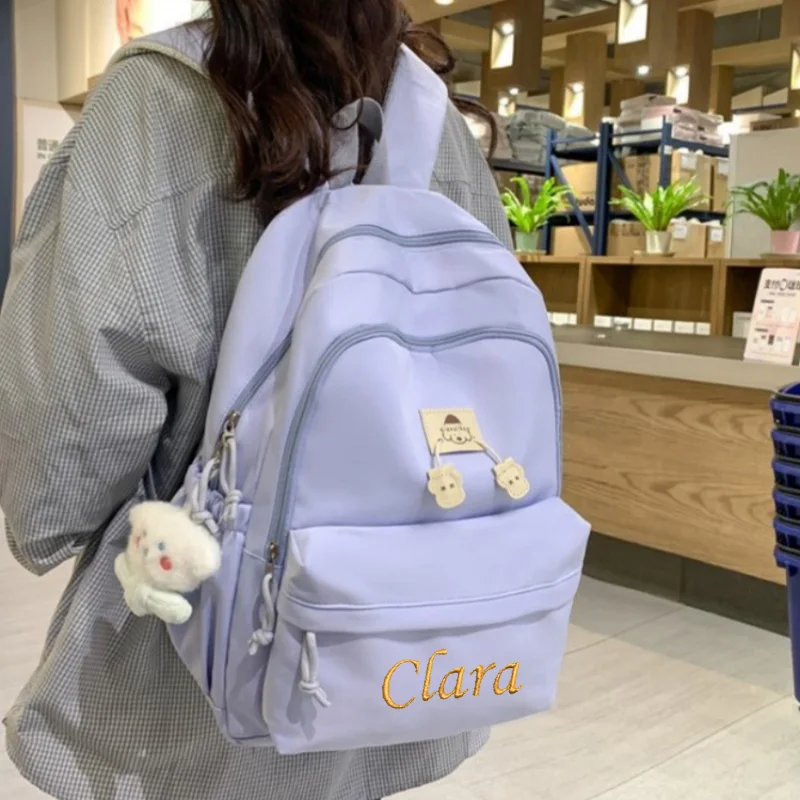 Bolsa de escola resistente ao desgaste impermeável respirável, mochila bordada personalizada para estudante universitário do ensino médio e casal