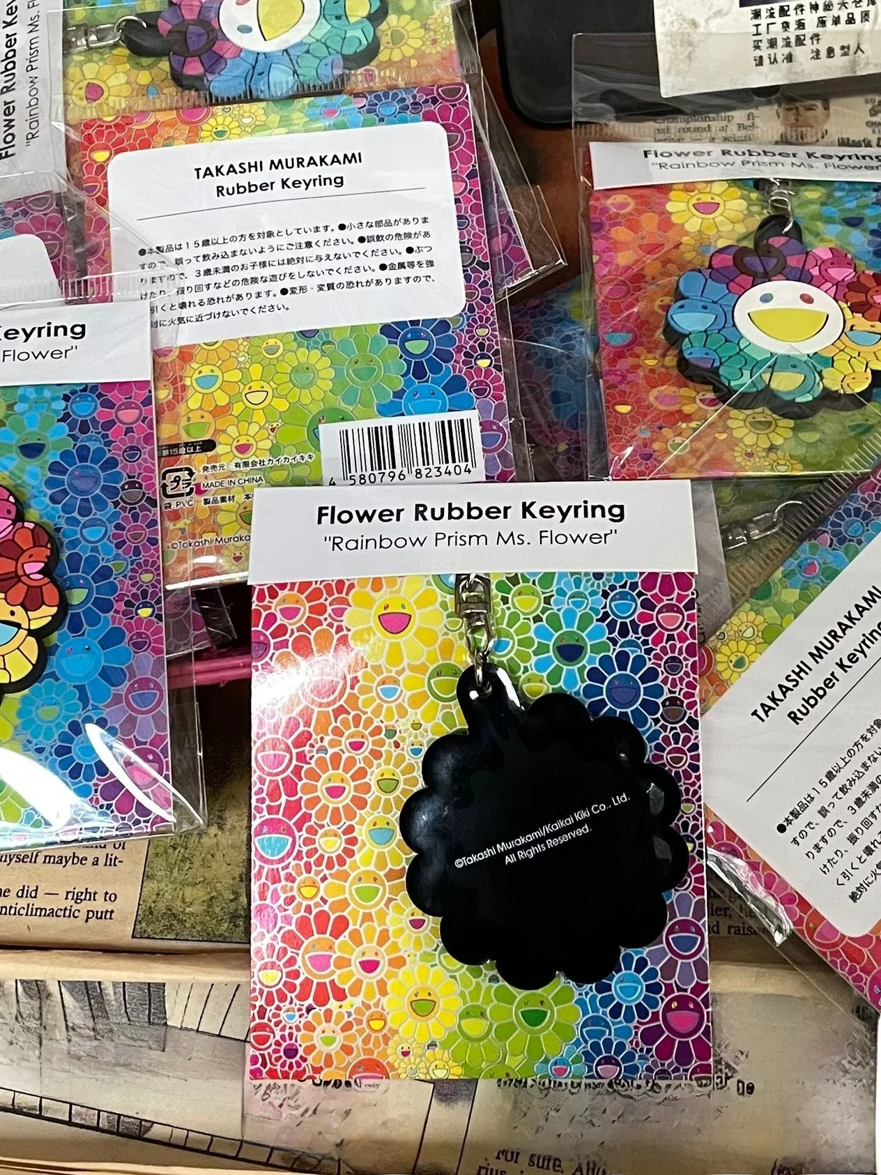 سلسلة مفاتيح على شكل عباد الشمس من تاكاشي، هدية إبداعية، قلادة دراجة نارية صغيرة، حامل مفاتيح من الفولاذ المقاوم للصدأ بأسلوب...