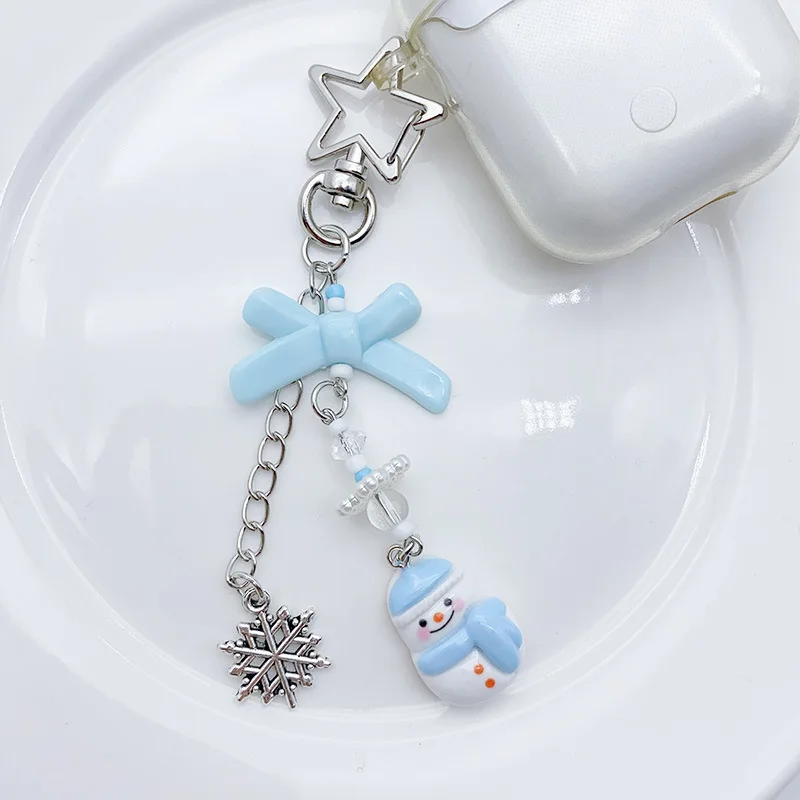 สายคล้องโทรศัพท์มือถือลายการ์ตูนน่ารัก รูปเกล็ดหิมะและตุ๊กตาหิมะ สำหรับฤดูหนาว  แบบหวานๆ อเนกประสงค์ เหมาะสำหรับสาวๆ แฟนสาว  ใช้คล้องกระเป๋าได้