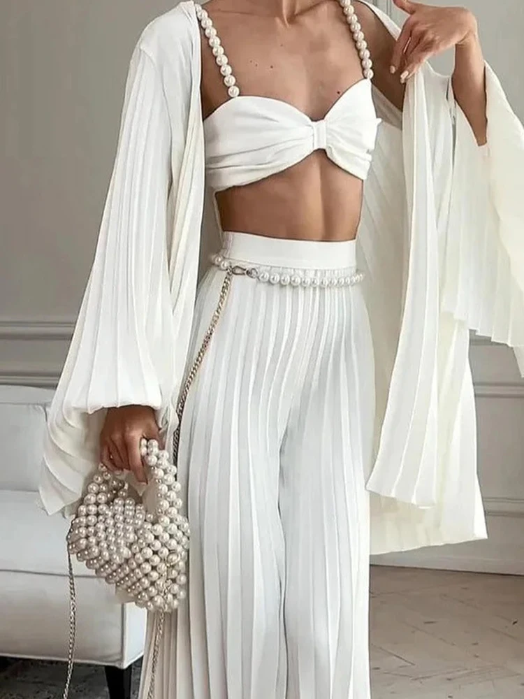 

Сексуальные укороченные топы и брюки с лямкой на шее, одинаковые комплекты, модные плиссированные свободные комплекты для поездок на работу, женский однотонный полый комплект для отпуска