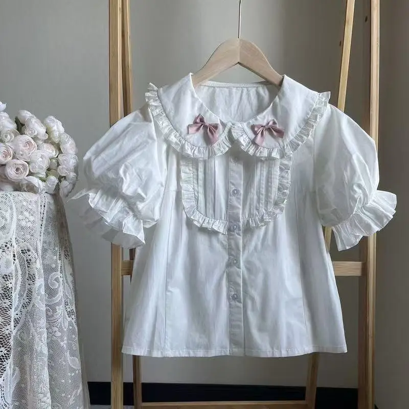 

Блузка женская 2026 Kawaii Lolita белая с короткими рукавами-фонариками, воротником Питер Пэн и рюшами, с розовым бантом, милая повседневная элегантная рубашка-топ