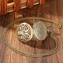 Watch open showing dial detail and chain clip