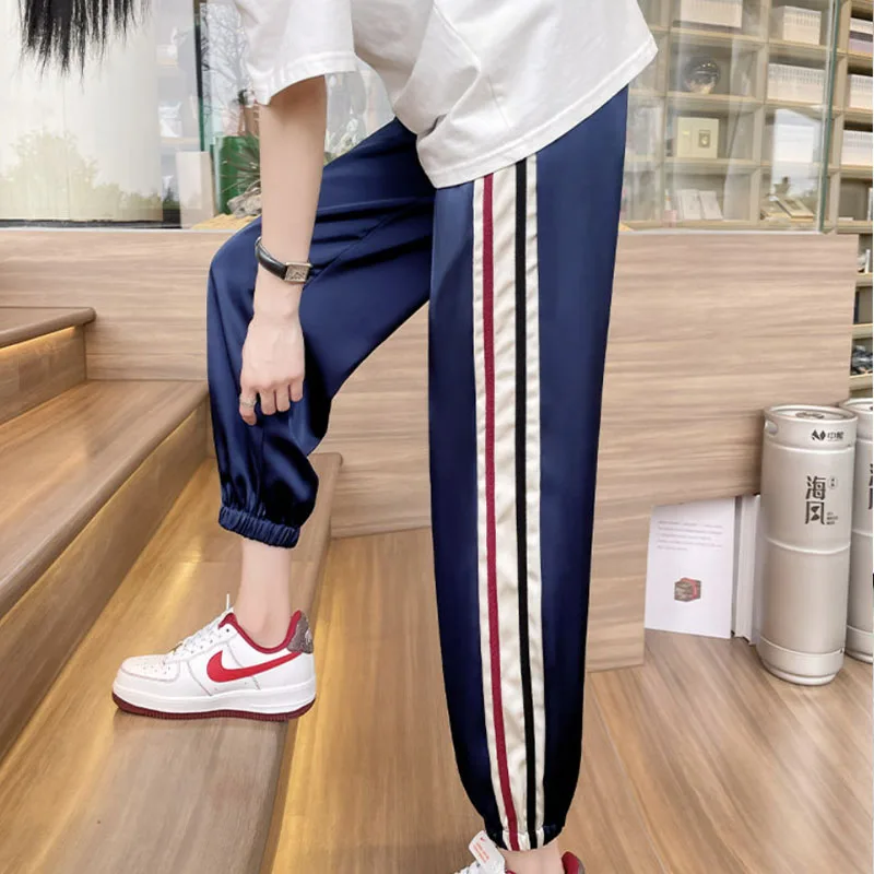 Streetwear Design Casual Ice Silk All-match pantaloni sportivi per le donne 2023 nuovi vestiti da donna coreani Harem Tie Feet pantaloni