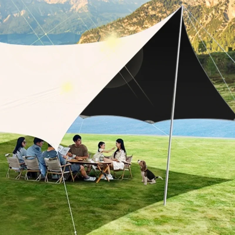 

A complete set of outdoor camping equipment, tables and chairs, including a canopy tent, a large outdoor camping equipment