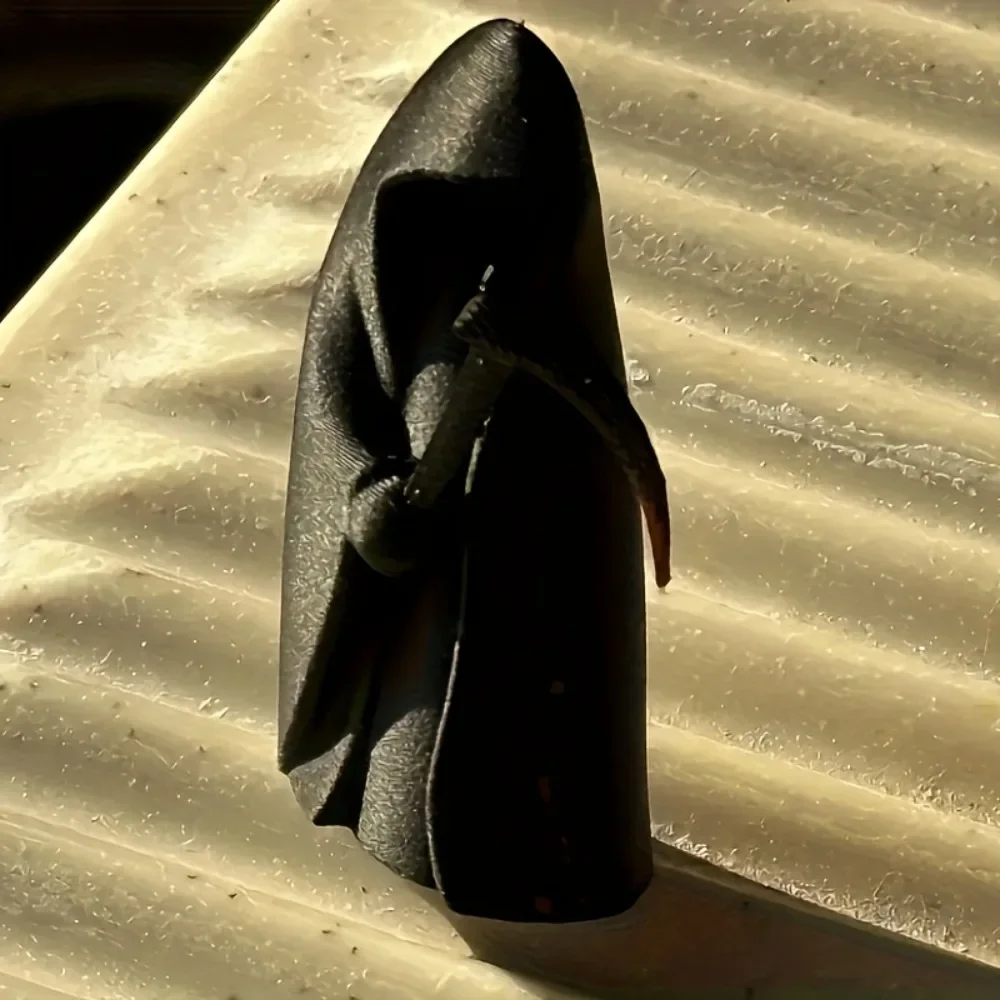 A cute MengMeng mini statue of death with a sickle,decorations.Gothic art plastic sculpture suitable for home and office