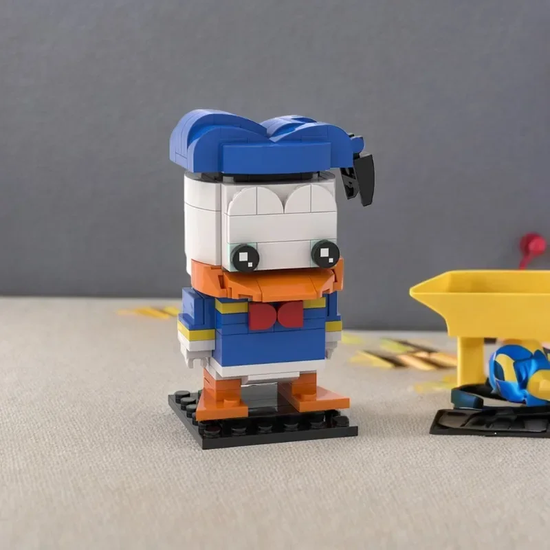 

166 деталей: Мини-конструктор Brickheadz Дональд Дак, модульные строительные блоки MOC, развивающие игрушки для сборки своими руками, подарки на день рождения для детей