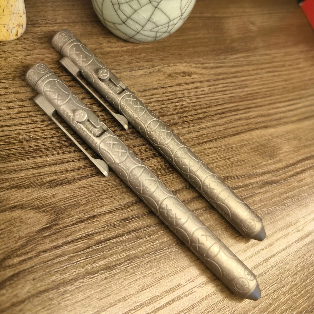 Outdoor Portable EDC Carving Crying Smiling Face Titanium Alloy Self-defense Tactical Pen Car Window Breaking Tool