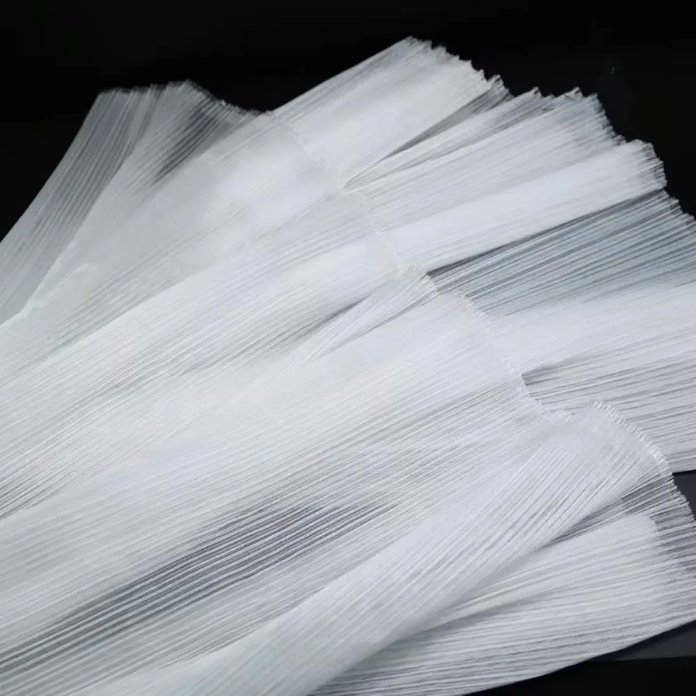 明るいオーガンザ生地硬い形状DIYプリーツメッシュ生地ポリエステル素材しわのある質感の生地背景花柄デザイン