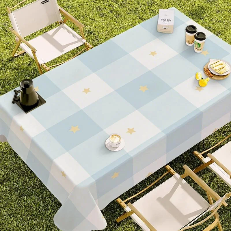 Single-sided printed tablecloth with a pattern of light blue and white checks, featuring yellow stars
