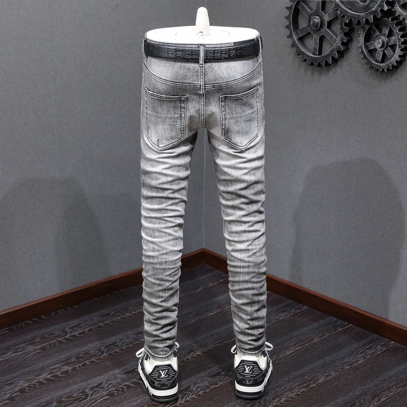 

designer's fashionable new jeans are full of elasticityY2K , slim fit, perforated patches, washed with nostalgia, retro light gr