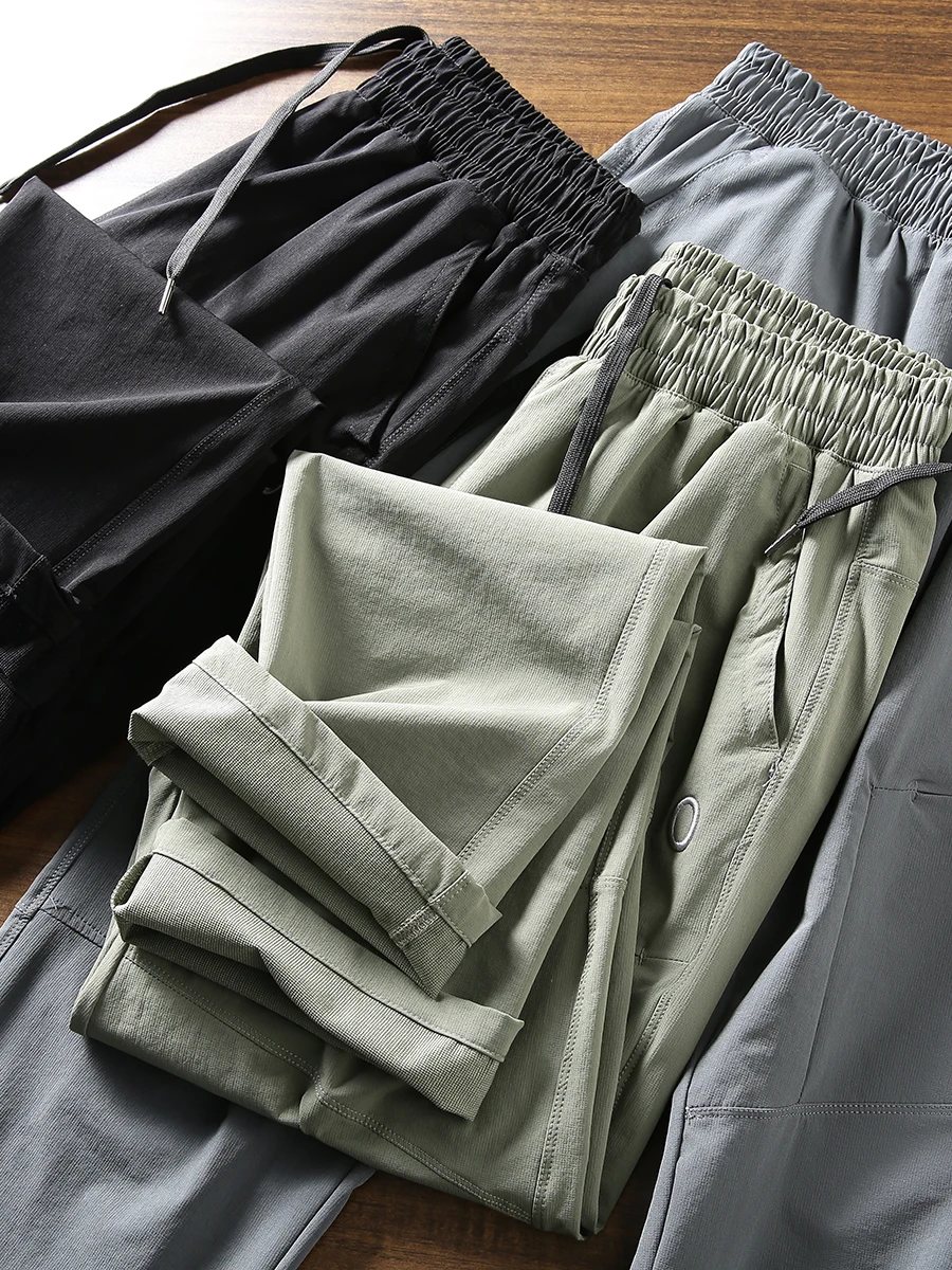 

Быстросохнущие спортивные повседневные брюки с эластичным поясом на четыре стороны, для активного отдыха, ветрозащитные, летние, с небольшими прямыми швами, дышащие, эластичные.