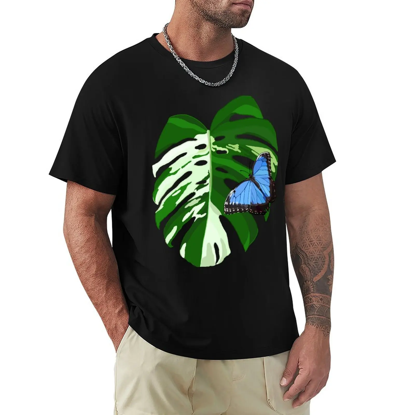 

Blue Morpho Butterfly on a Monstera Albo Leaf T-Shirt tops graphics basketball graphic tees custom shirt plain t shirts men