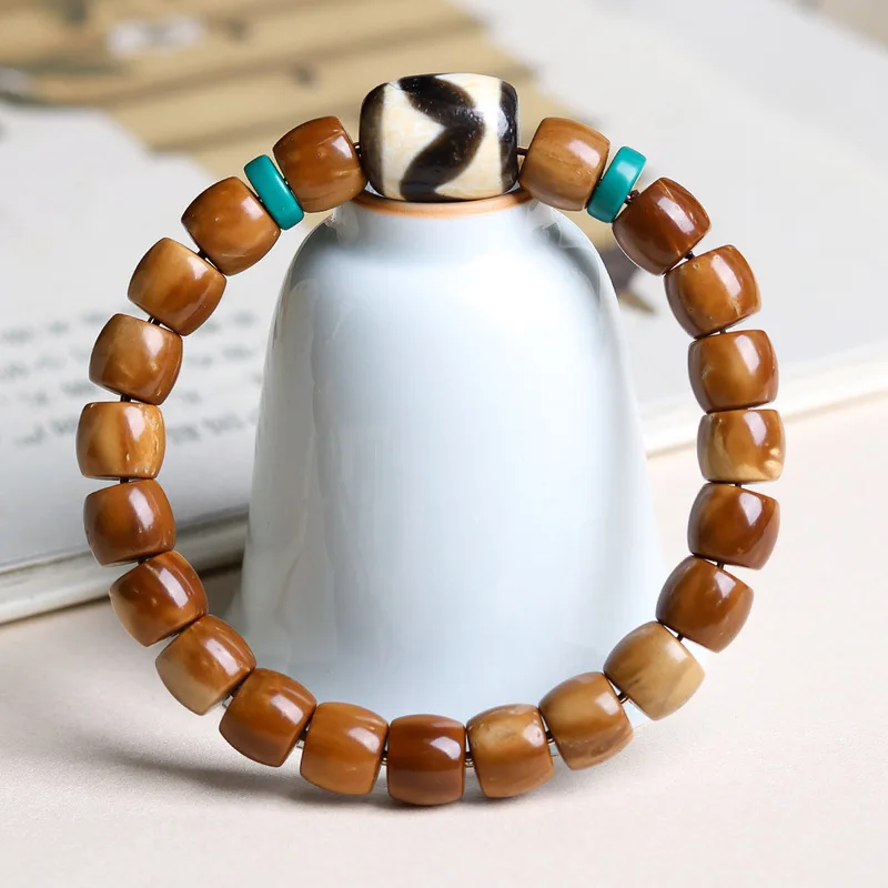 Minimalist tiger's tooth Dzi bead bracelet a collection of Tibetan-style beads for both men and women featuring straight