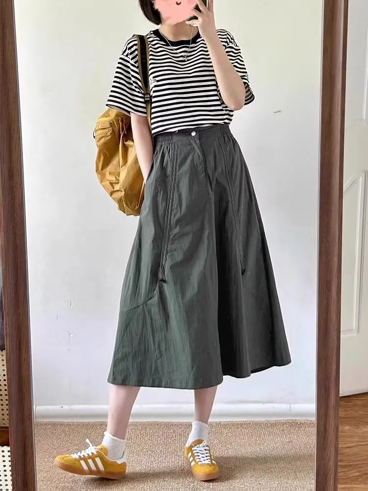 Femme nouveau dans les vêtements a-ligne taille haute décontractée minceur gâteau jupe polyvalent mi-longue robe douce noir jupe longue tout-match