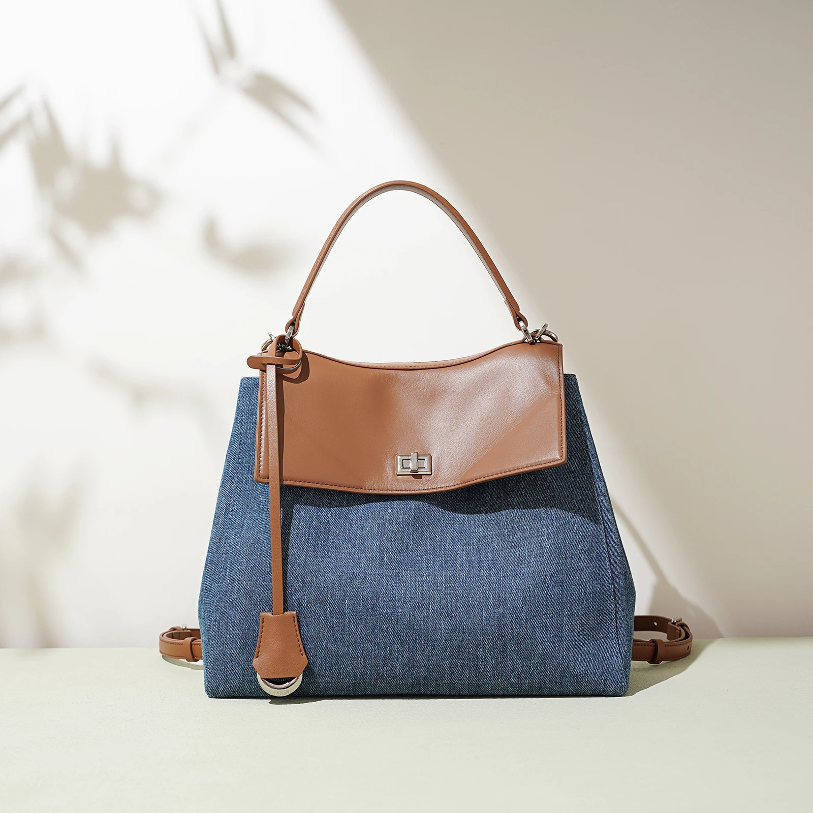 

Modern classic design backpack for girls, popular and retro style. Made of denim fabric. Fashionable school bag. Handbag. Backpa