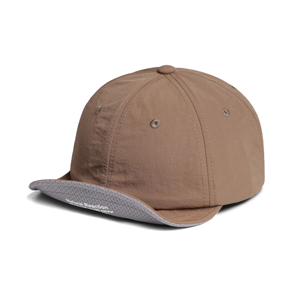 A baseball cap with printed color patterns and rolled edges, featuring a flat brim, suitable for both casual and sports wear.