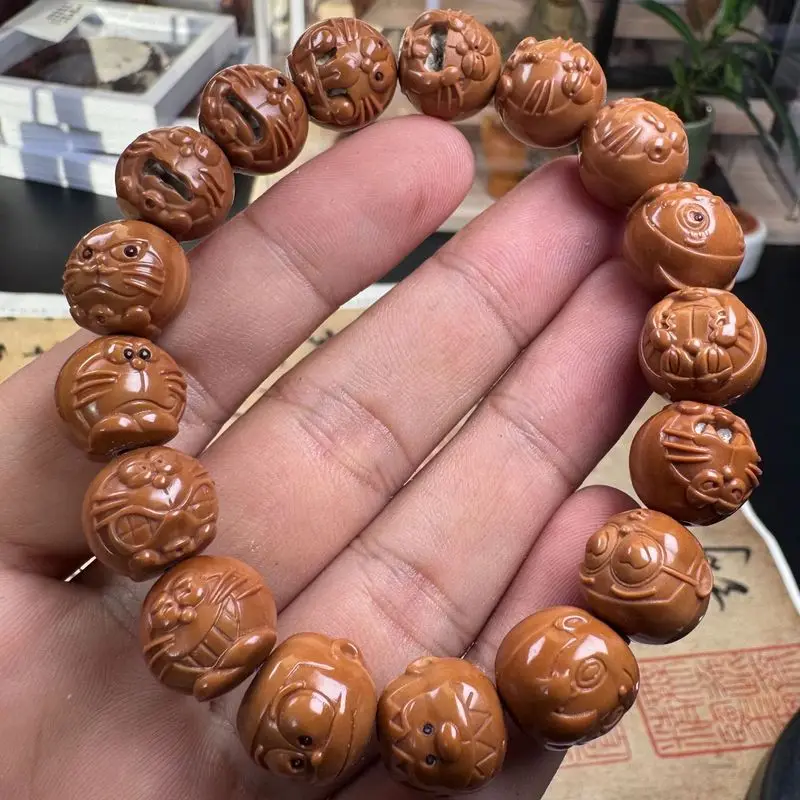 Hand-carved monkey head walnut bead bracelet, a fine piece of art for both men and women, with black spots (B-grade)