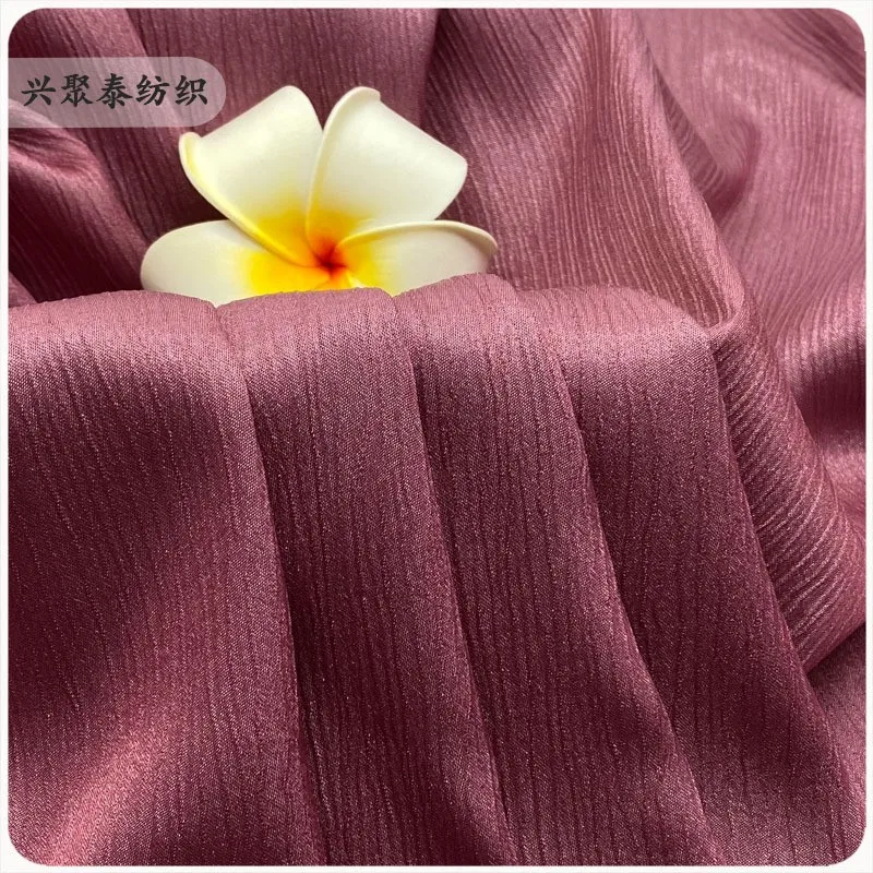 

The glittering multi-layered wrinkled dress material It weighs 140 grams has a glossy imitation acetic acid fashion shoe fabric