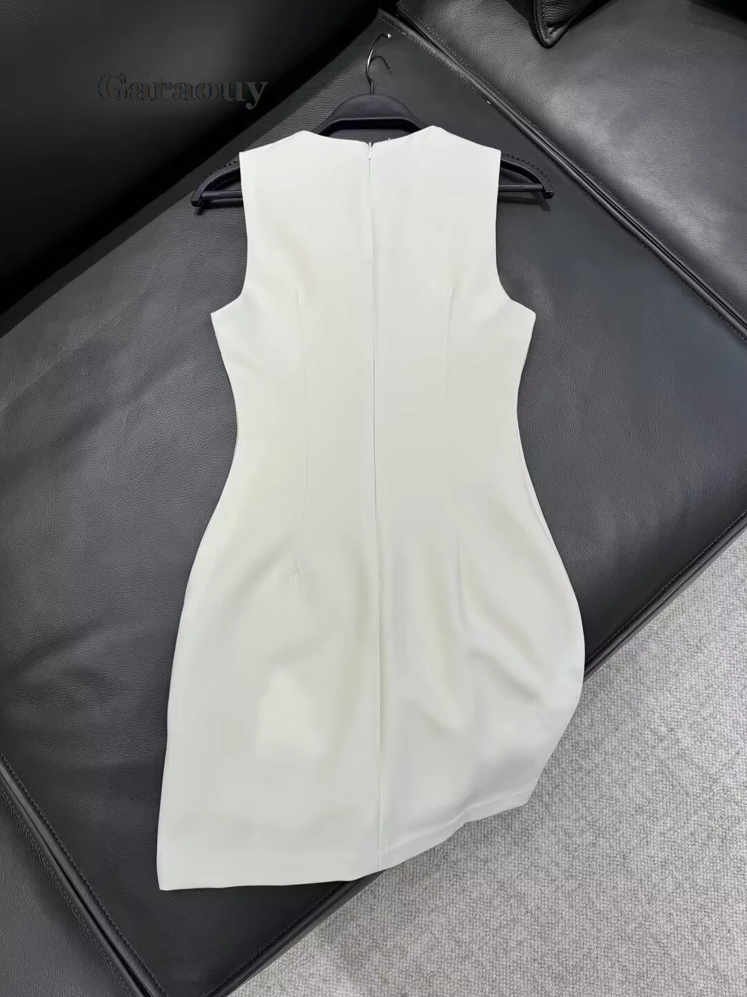 Garaouy Woman Sleeveless Back Zipper White Slim Short Dress Female Elegant Sexy Hollow Out O Neck Leather Buckle Chic Mini Dress