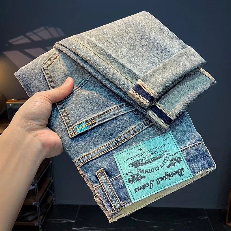 Celana jins pria musim panas, celana denim mode Semua cocok kasual dicuci, celana ketat melar Slim fit, katun kelas atas