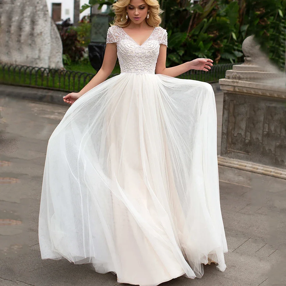 

Exquisite Handmade Pearl Beaded Wedding Dress Classic V-Neck Short Sleeves A-Line Bride Floor Length Tulle Sexy Backless Gowns