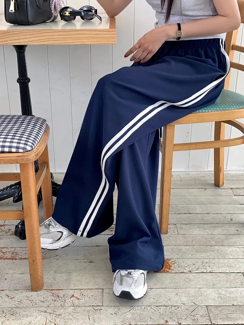 กางเกงขายาวลายทางลำลองสำหรับผู้หญิง เอวยางยืดแบบผูกเชือก ทรงหลวม ใส่สบาย ช่วยพรางหุ่น แฟชั่นทันสมัย