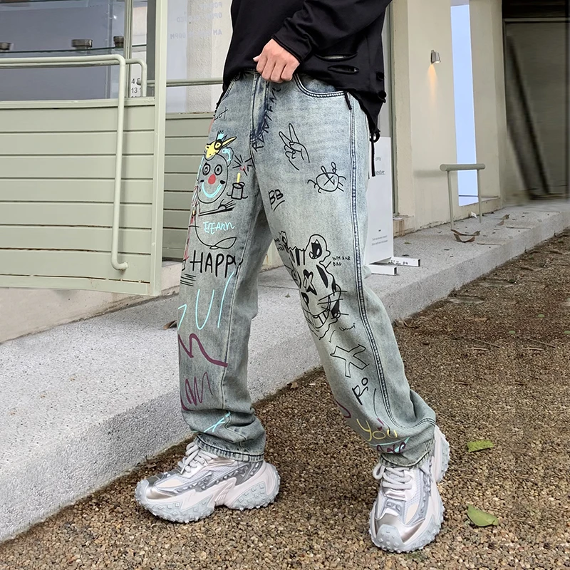 Streetwear jeans grafiti pria, celana kasual peplum kaki lebar lurus longgar populer jalanan Amerika kelas atas