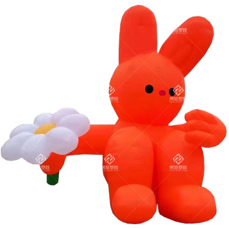 Coniglio gonfiabile per la decorazione del cortile del giardino, fiore arancione che tiene il coniglio seduto, decorazione per la celebrazione della festa