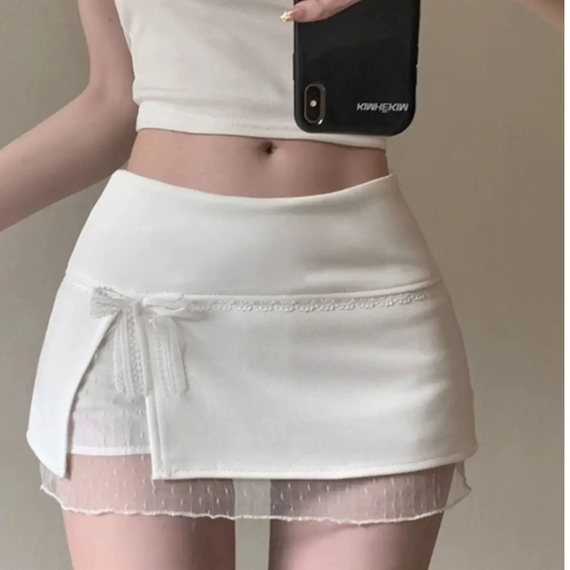 

Новая весенняя коллекция 2025: Женская короткая юбка-трапеция с кружевными вставками и узлом, облегающая, с высокой талией, из полиэстера.