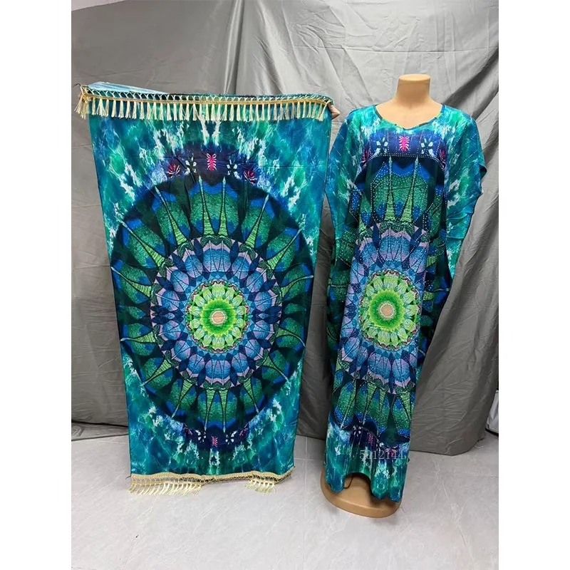 2026 Modieuze Afrikaanse vrouwen jurk rayon positionering hot boren afdrukken losse strand jumpsuit lange jurk groot formaat gewaad
