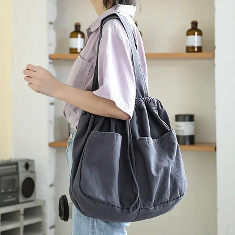 2023 New Canvas Bag Women's One Shoulder Drawstring Multi Pocket Japanese Simple Large Capacity Casual Versatile Tote Bag