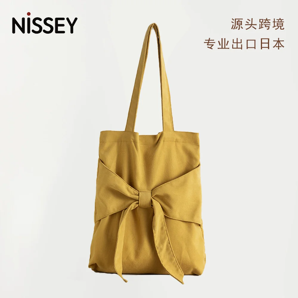 

Butterfly knot tote bag, artistic single shoulder women's bag, student canvas bag, niche design, large capacity Japanese handbag