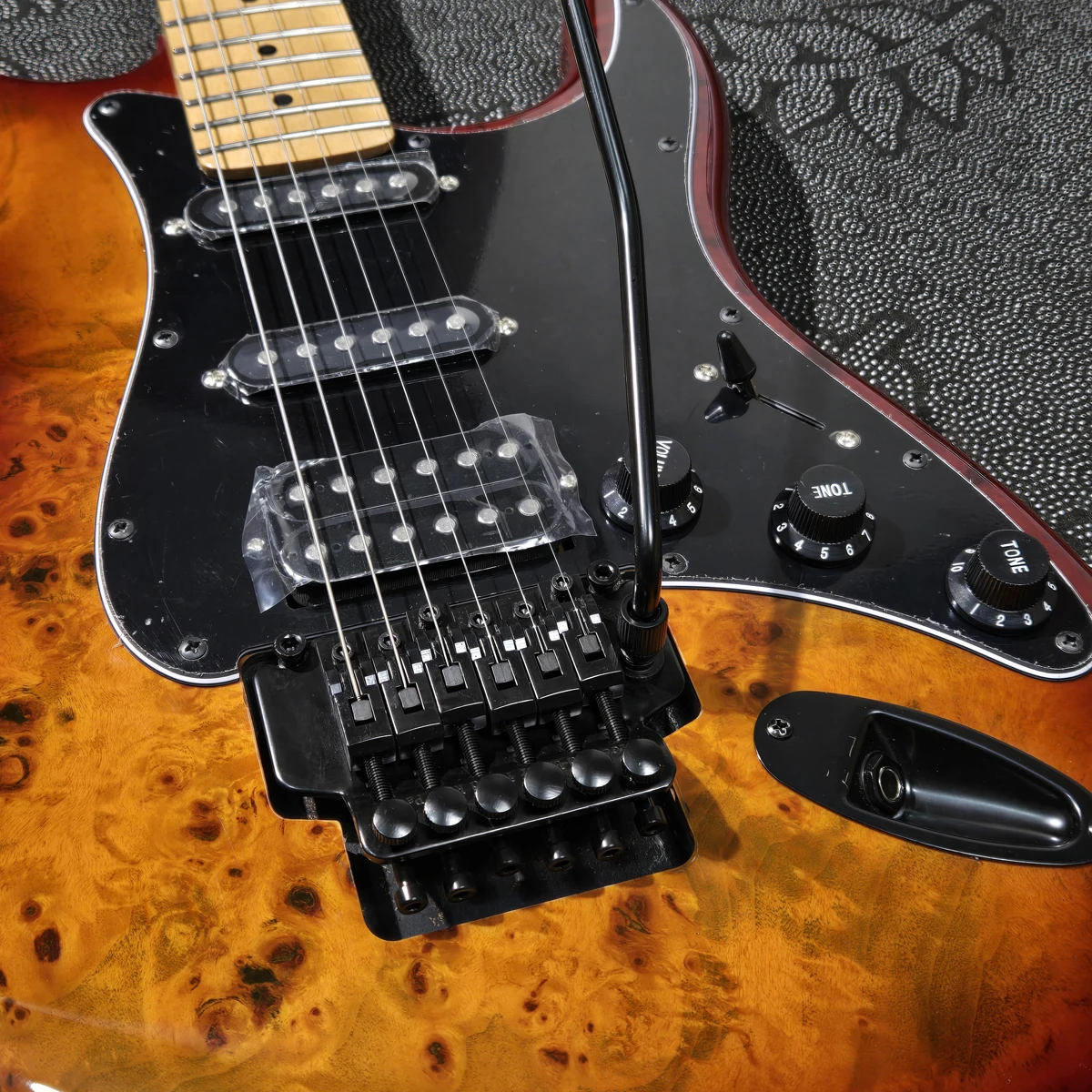 High-quality electric guitar, burl veneer, maple neck,  S-S-H pickups, double-locking tremolo system, in stock fast shipping