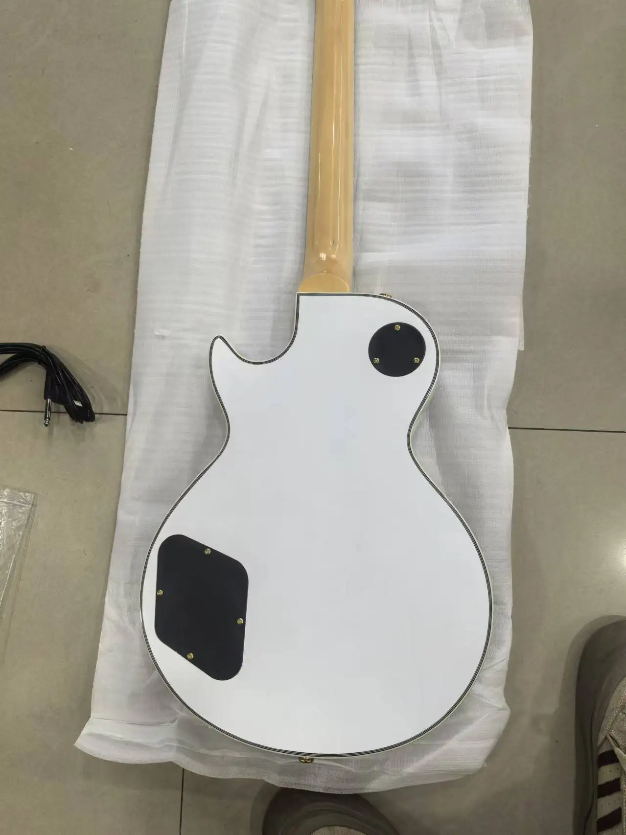 High quality metallic yellow, white electric guitar with black knobs