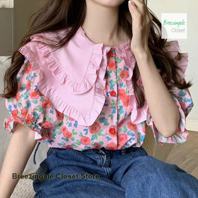 Korean sweet cute little girl doll collar floral short sleeve shirt female summer sweet loose fashion design Joker casual top.