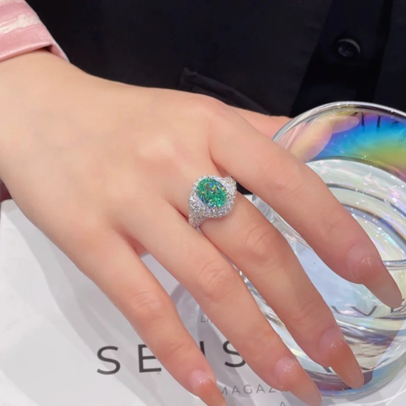 Gold-plated copper ring fully inlaid with oval synthetic Paraiba blue-green zircon, open ring, wholesale customization
