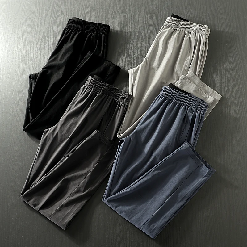 

Men's Thin Qui Dry Breathable Four-Dimensional Elastic Straight Leg Spor Casual Long Pants Summer Laser Punching