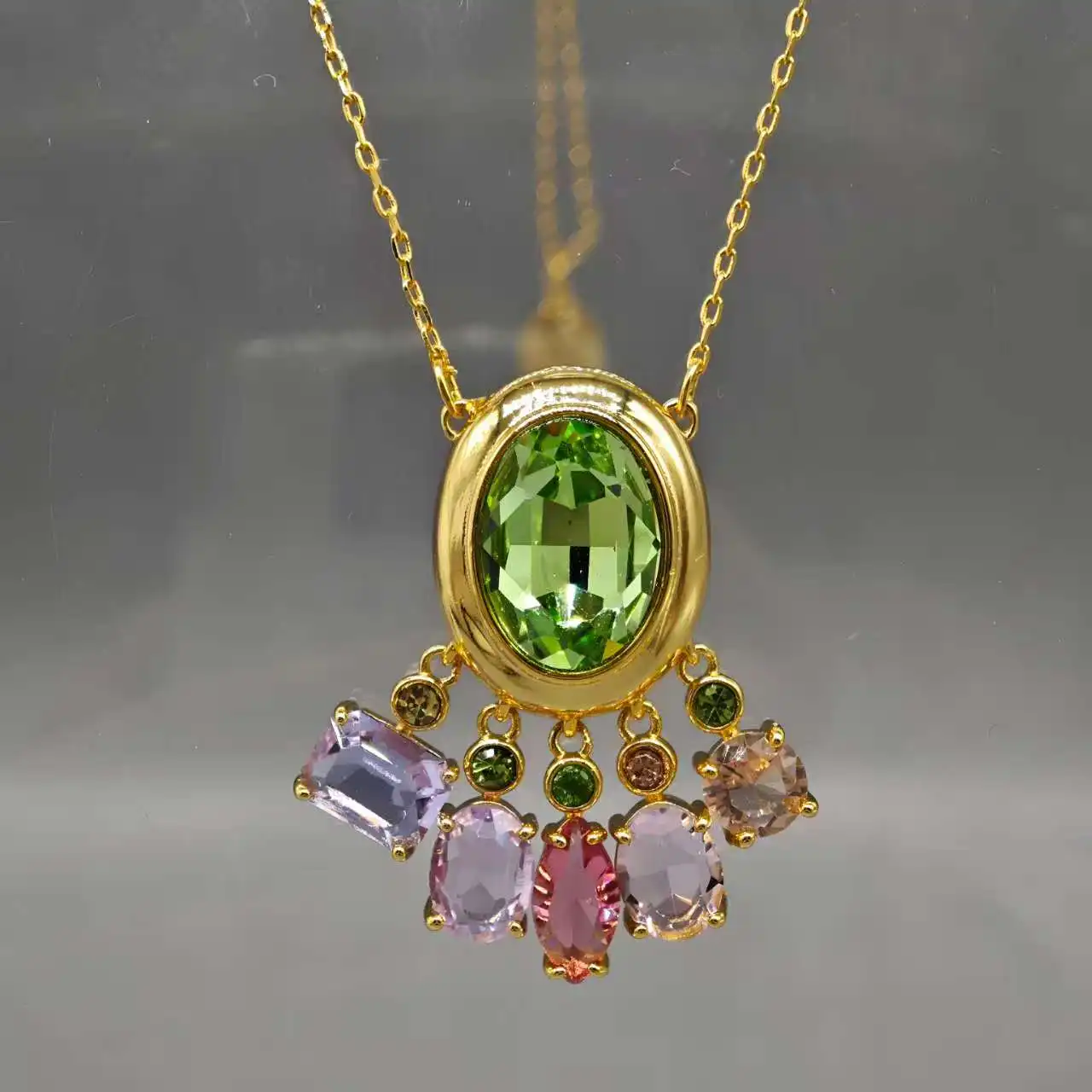 

New products in February 26 Vintage Inspired Gold Pendant Necklace with Oval Green Peridot & Cascading Rainbow Gemstones