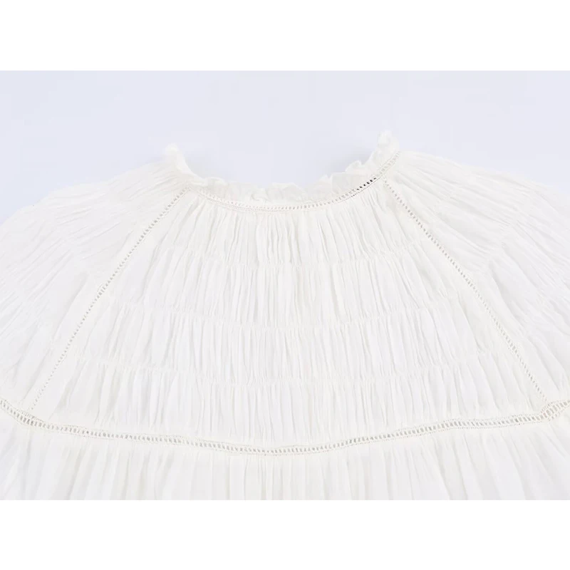 YENKYE بلوزة بيضاء رومانسية على شكل قرص العسل للنساء بأكمام واسعة ورقبة دائرية ملابس علوية غير رسمية لربيع 2026