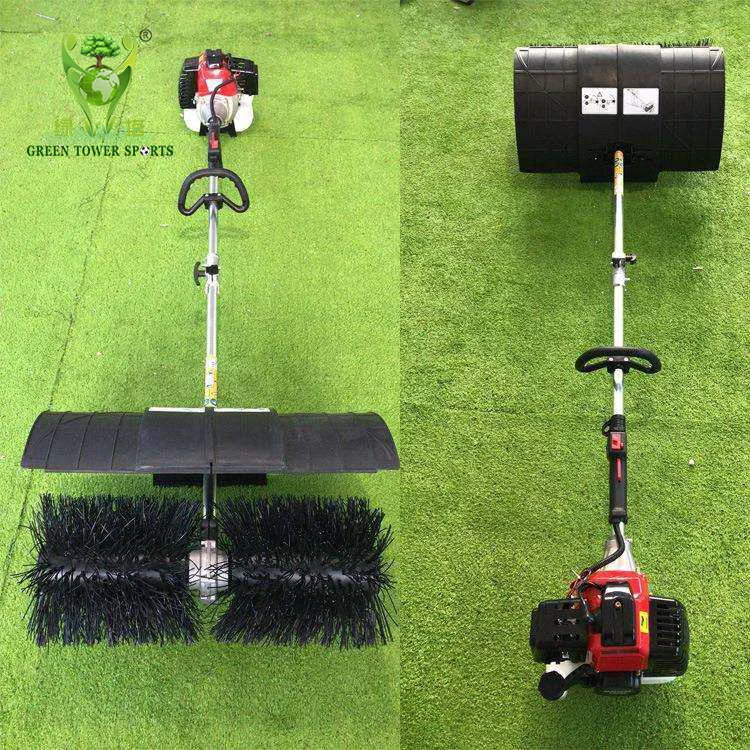 Handheld lawn sweeper/brush for artificial turf cleaning.