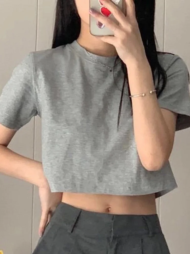 تي شيرت حريمي مقصوص متين ومثير وبسيط عرض ساخن نحيف غير رسمي موضة Preppy Chic ملابس علوية أساسية على الطراز الكوري ملابس الشارع الشهير