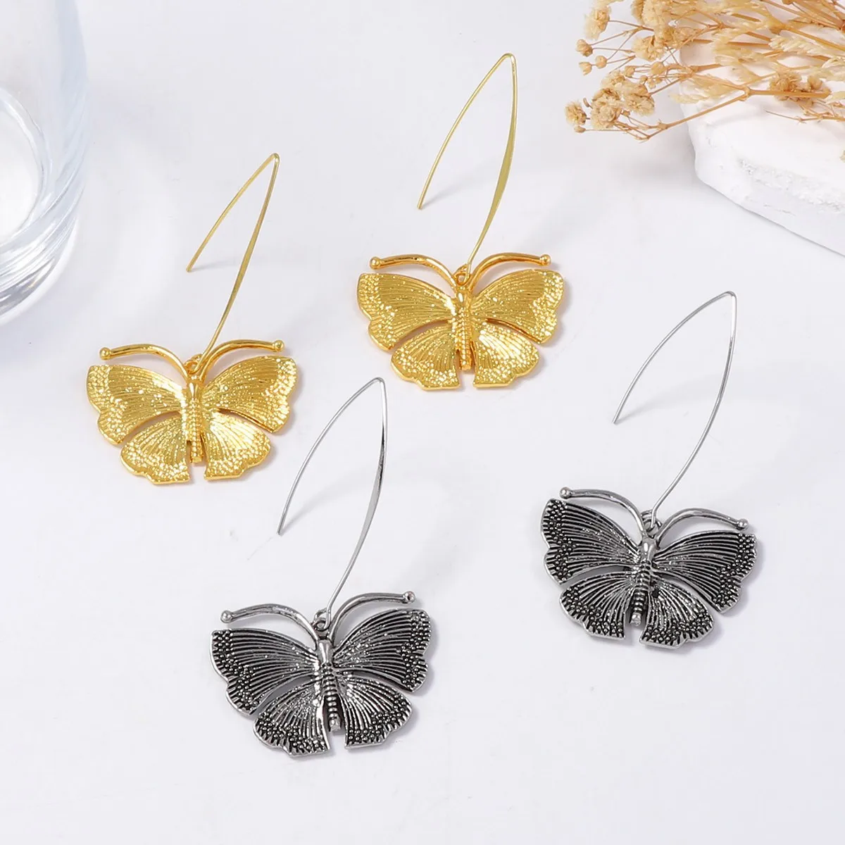 Light luxury high-end retro new versatile niche old style alloy temperament long butterfly pendant women's earrings