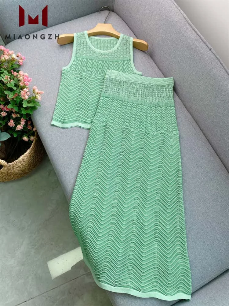 

High Quality Fashion Hollow Out 2 Pieces Set For Women O Neck Sleevess Tops Vest High Waist Casual Skirt Ladies New Knitted Suit