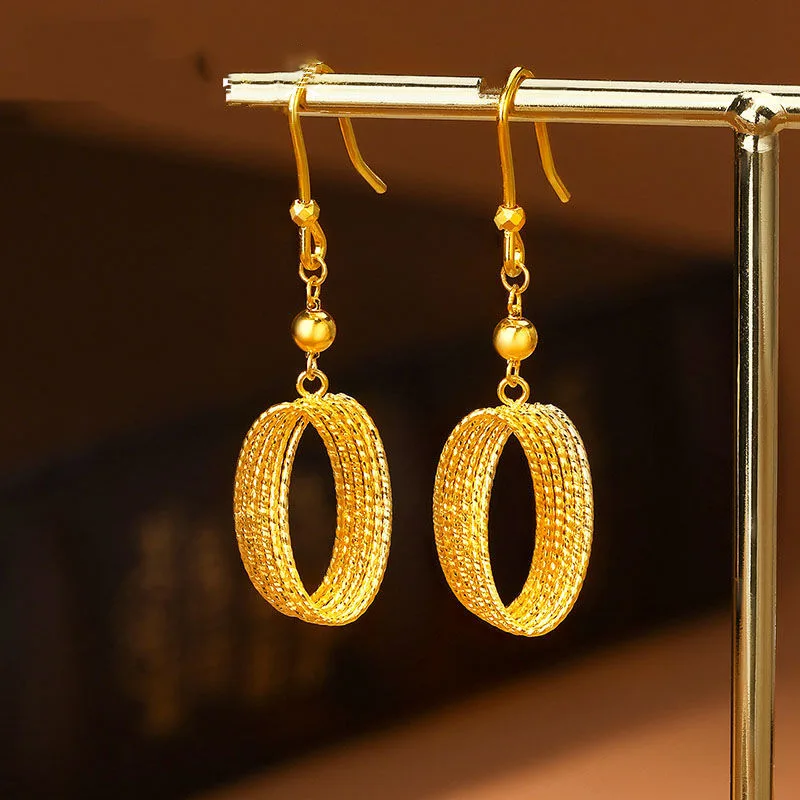 

Gold store same style Mobius light and shadow earrings 24K real gold ear hooks hollow brushed light luxury 9999 ear studs