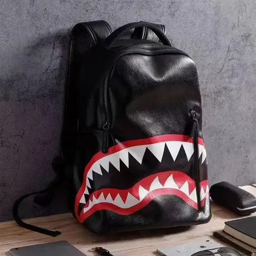 Imagen 1 del producto Mochila JIAERDI de tiburón negra a la moda, mochila de cuero con estampado de dibujos animados para hombre, mochila de gran capacidad para mujer, bolso escolar único y fresco para estudiantes