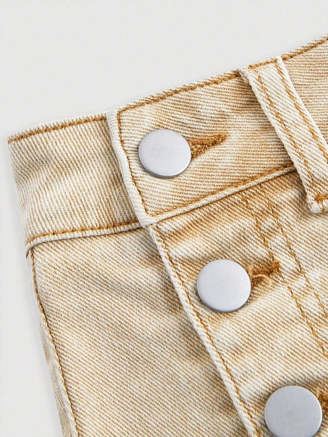 Jupe en jean courte pour femme, délavée, boutonnée sur le côté, avec ourlet asymétrique