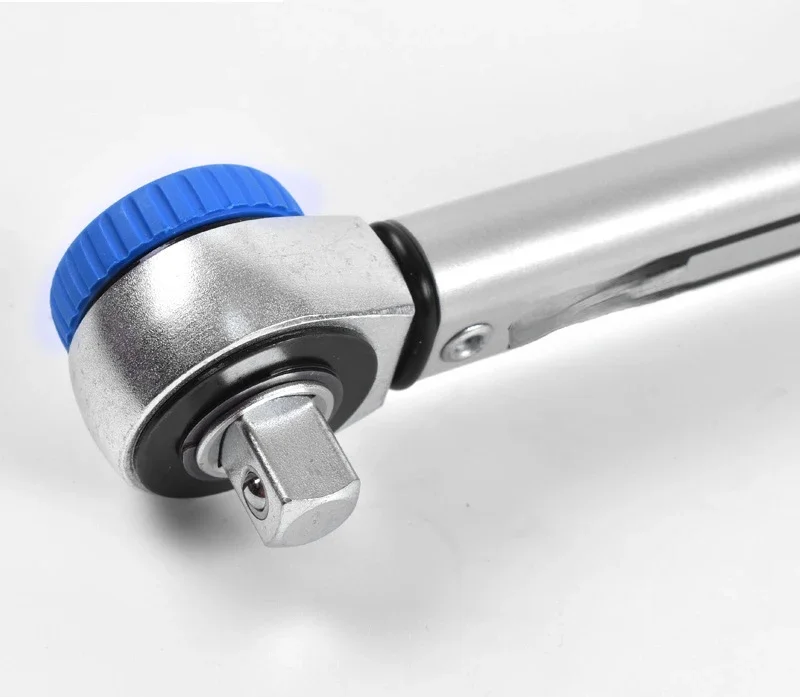 Adjustable torque wrench window displays reversible ratchet torque wrench.