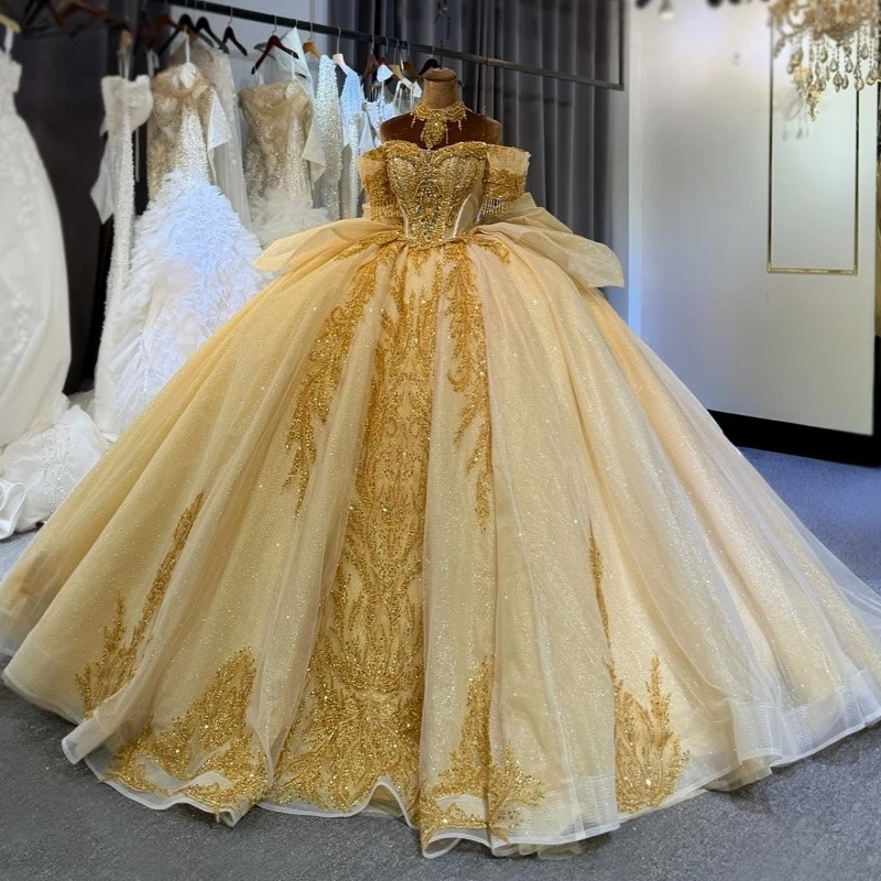 

Champagne Shiny Ball Gown Quinceanera Dresses Gold Applique Lace Beading Crystal Bow Tull Corset Off Shoulder Sweet 16 Dress