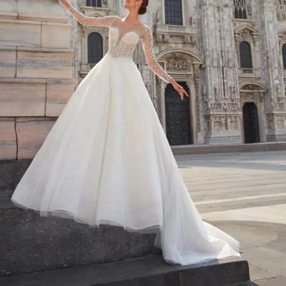 カスタムメイドのビーズ装飾が施されたウェディングドレス、ロングスリーブ、キラキラ輝くチュールのボールガウン、花嫁用、ボタンバック、ローブ・ド・マリアージュ